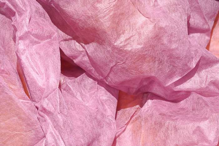 Pozadí průhledně růžové - netkaná textilie