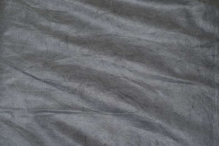 Pozadí průhledně šedé - netkaná textilie